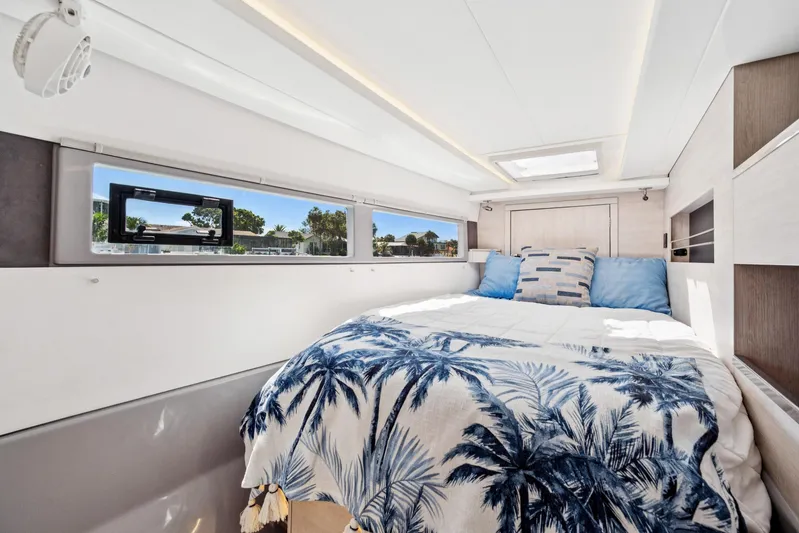 Always Wet Yacht Photos Pics Luxurious bedroom interior of 2021 Leopard 45 yacht with scenic window view.