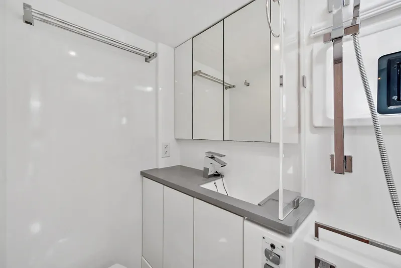 Always Wet Yacht Photos Pics Modern bathroom in 2021 Leopard 45 yacht with sleek fixtures and mirrored cabinets.