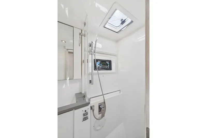 Always Wet Yacht Photos Pics Modern bathroom interior in 2021 Leopard 45 yacht, featuring sleek design and skylight.