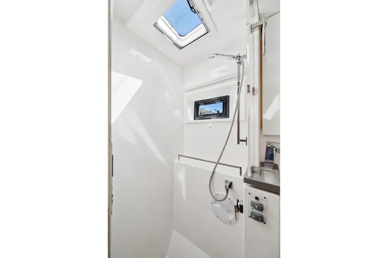 Always Wet Yacht Photos Pics Modern bathroom interior on 2021 Leopard 45 yacht with skylight and shower.
