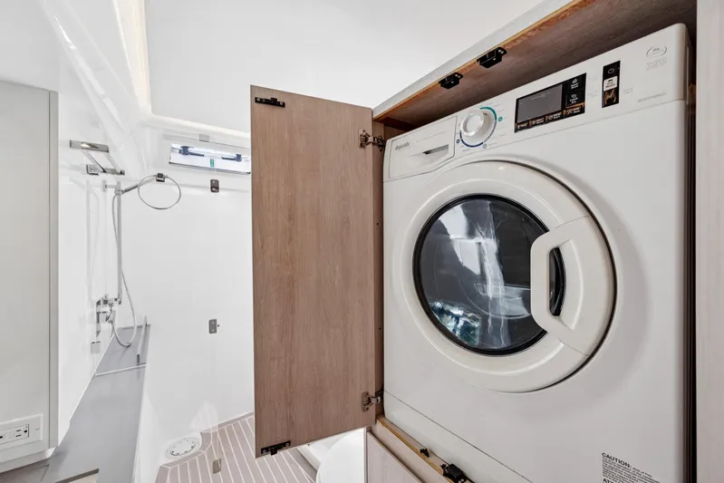 Always Wet Yacht Photos Pics Laundry area with washer in 2021 Leopard 45 yacht bathroom.