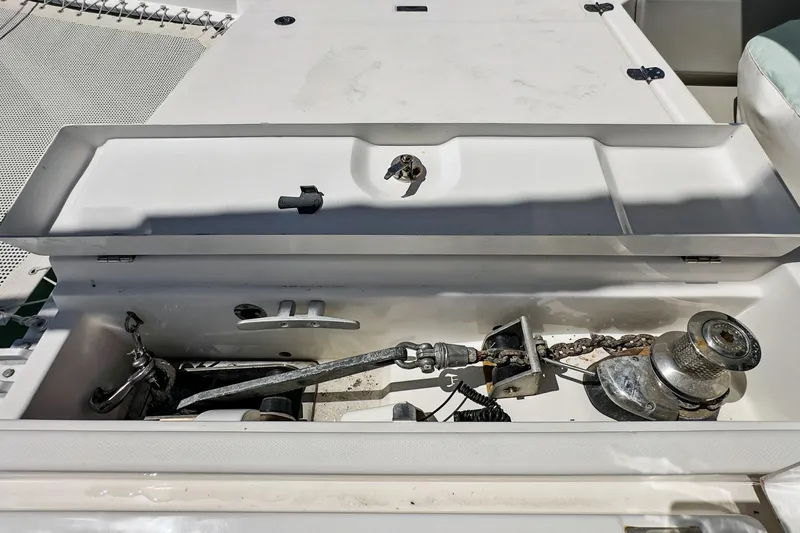 Always Wet Yacht Photos Pics Anchor compartment of 2021 Leopard 45 catamaran with winch and chain.
