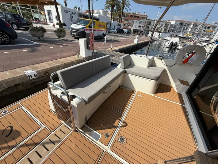 Cassiopee Yacht Photos Pics 2023 Beneteau Swift Trawler 41 Fly, spacious deck with seating, docked at marina.