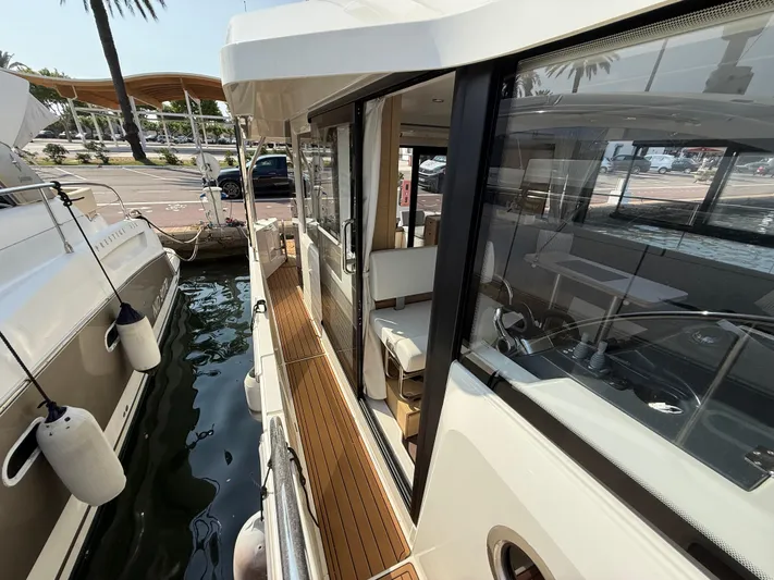 Cassiopee Yacht Photos Pics 2023 Beneteau Swift Trawler 41 Fly docked, showcasing sleek design and spacious deck area.