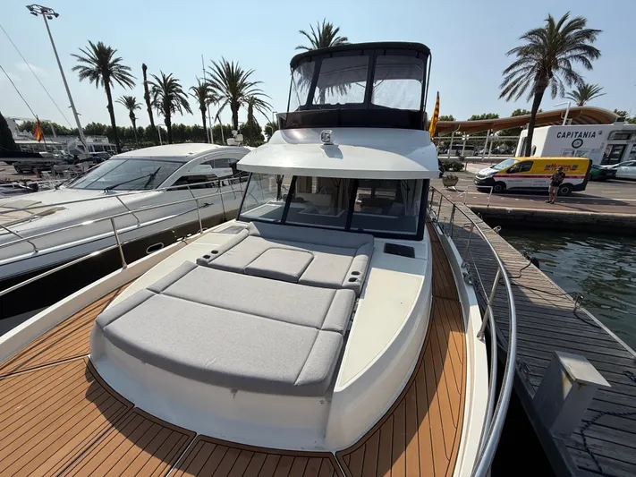 Cassiopee Yacht Photos Pics 2023 Beneteau Swift Trawler 41 Fly docked, featuring spacious deck and flybridge.