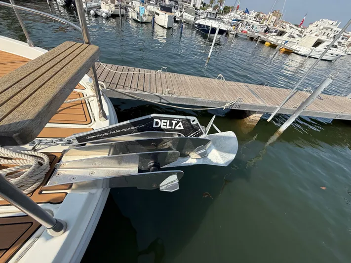 Cassiopee Yacht Photos Pics 2023 Beneteau Swift Trawler 41 Fly with Delta anchor at marina dock.