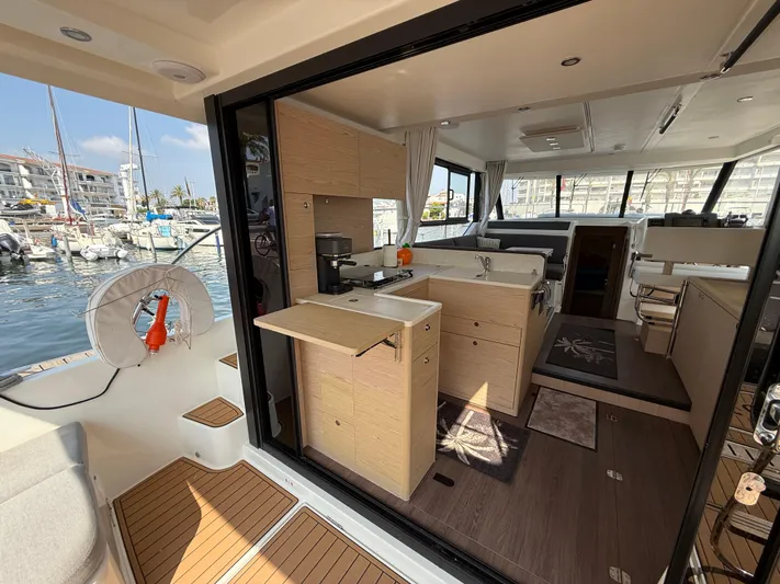 Cassiopee Yacht Photos Pics Interior view of 2023 Beneteau Swift Trawler 41 Fly, featuring modern kitchen and spacious layout.