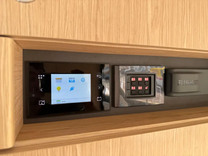 Cassiopee Yacht Photos Pics Control panel of 2023 Beneteau Swift Trawler 41 Fly, featuring touchscreen and buttons.