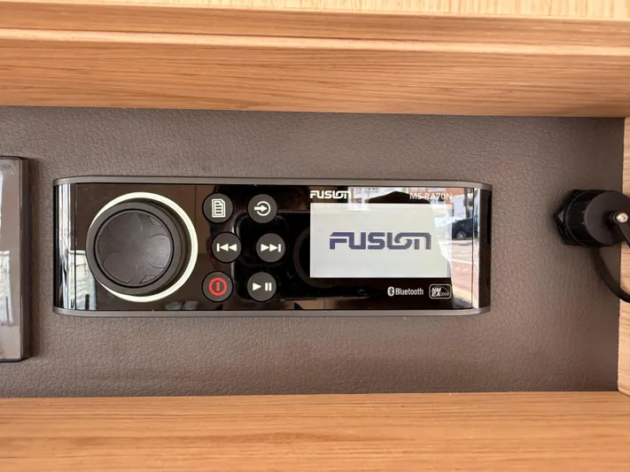 Cassiopee Yacht Photos Pics Fusion audio system on 2023 Beneteau Swift Trawler 41 Fly, featuring Bluetooth connectivity.
