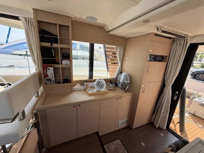 Cassiopee Yacht Photos Pics Interior of 2023 Beneteau Swift Trawler 41 Fly, featuring modern cabinetry and ample natural light.