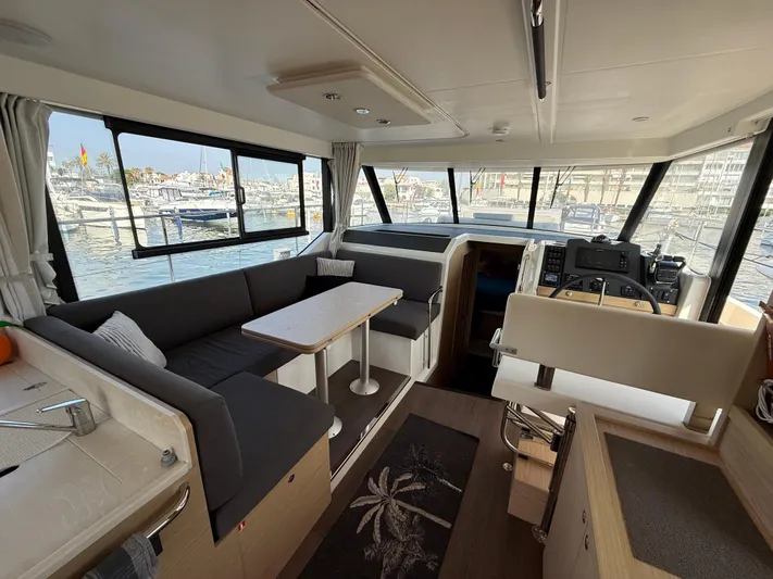 Cassiopee Yacht Photos Pics Interior of 2023 Beneteau Swift Trawler 41 Fly, featuring spacious seating and modern design.