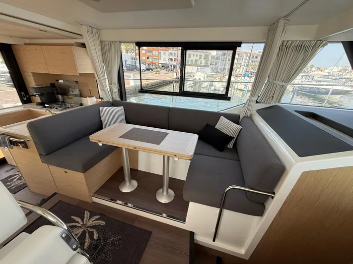 Cassiopee Yacht Photos Pics Interior of 2023 Beneteau Swift Trawler 41 Fly with cozy seating and dining area.