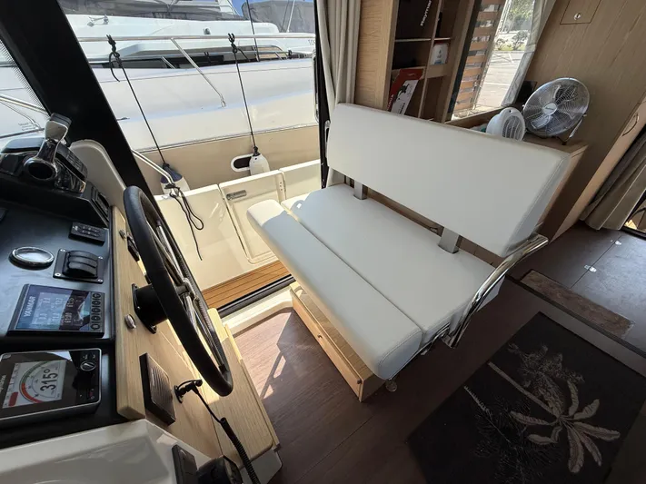 Cassiopee Yacht Photos Pics Interior of 2023 Beneteau Swift Trawler 41 Fly, featuring helm and seating area.