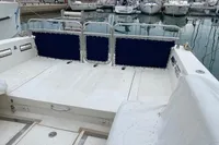 2002 Quer 32 Fish Cuddy boat deck with marina view.