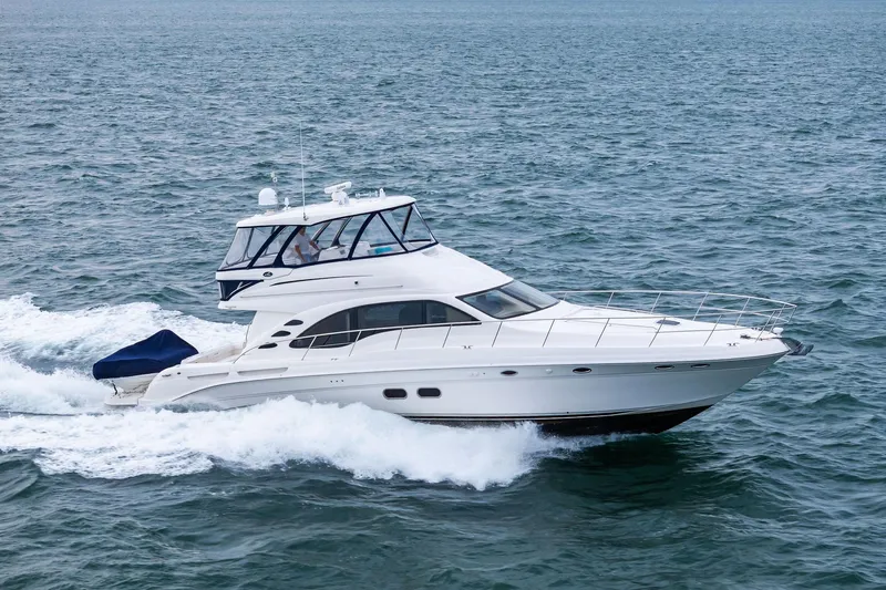 Sea-dels Yacht Photos Pics 2007 Sea Ray 58 Sedan Bridge yacht cruising on open water.