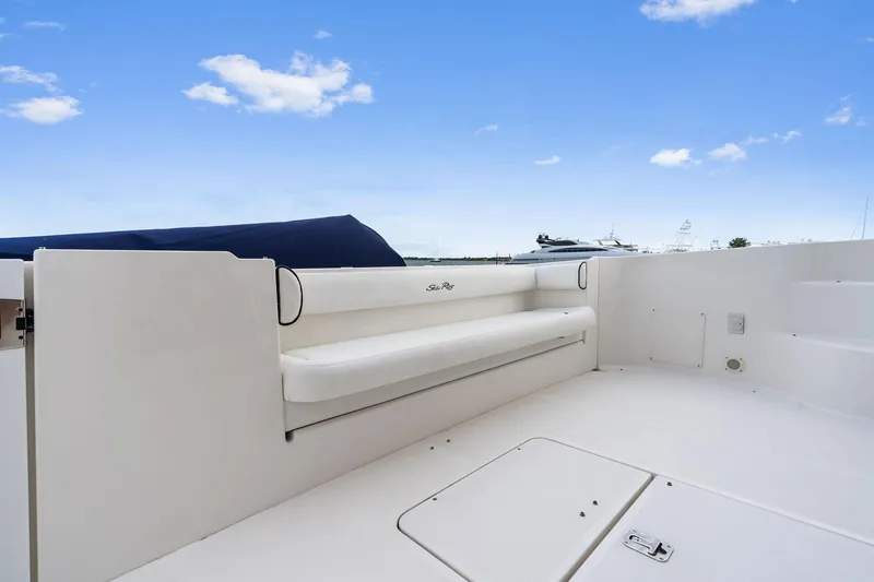 Sea-dels Yacht Photos Pics 2007 Sea Ray 58 Sedan Bridge yacht deck with seating, under a clear blue sky.