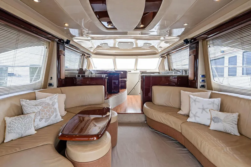 Sea-dels Yacht Photos Pics Luxurious interior of 2007 Sea Ray 58 Sedan Bridge yacht with elegant seating and decor.