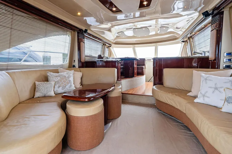 Sea-dels Yacht Photos Pics Luxurious interior of 2007 Sea Ray 58 Sedan Bridge yacht with plush seating and elegant design.
