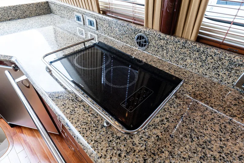 Sea-dels Yacht Photos Pics Granite countertop with electric cooktop on 2007 Sea Ray 58 Sedan Bridge yacht.