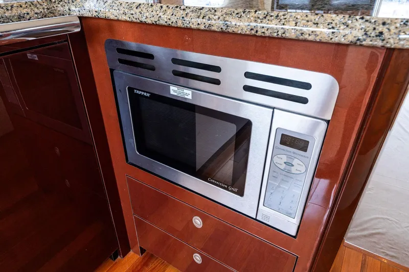 Sea-dels Yacht Photos Pics Built-in microwave in 2007 Sea Ray 58 Sedan Bridge yacht kitchen.
