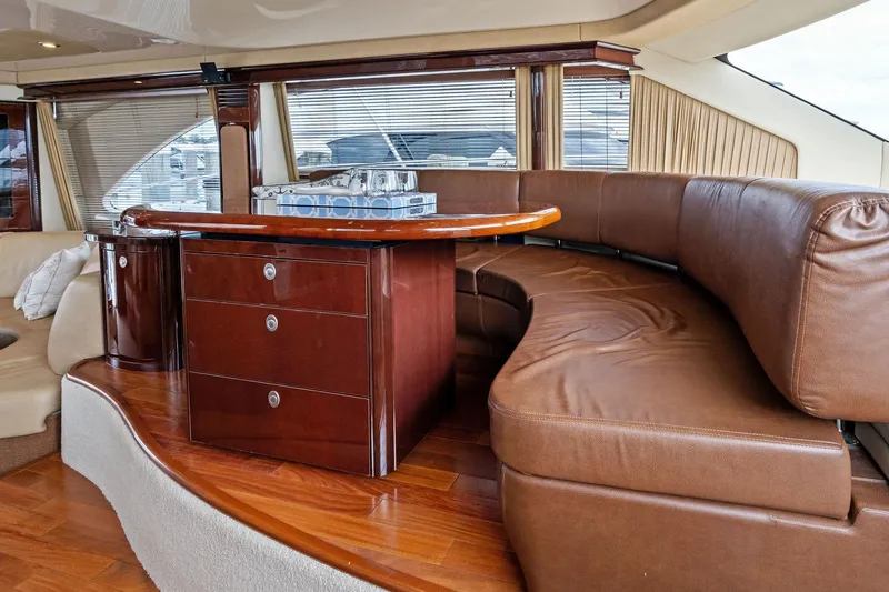 Sea-dels Yacht Photos Pics 2007 Sea Ray 58 Sedan Bridge interior with luxurious leather seating and elegant wood finishes.