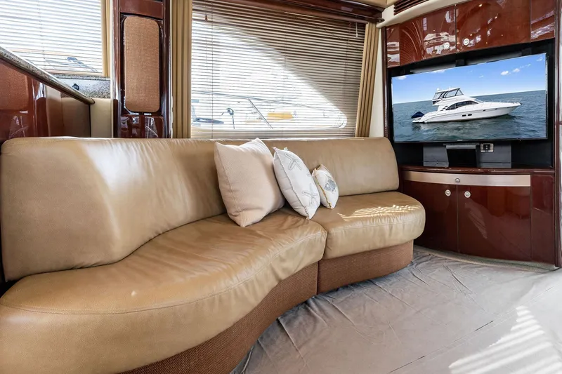 Sea-dels Yacht Photos Pics Luxurious interior of 2007 Sea Ray 58 Sedan Bridge yacht with leather seating and TV.