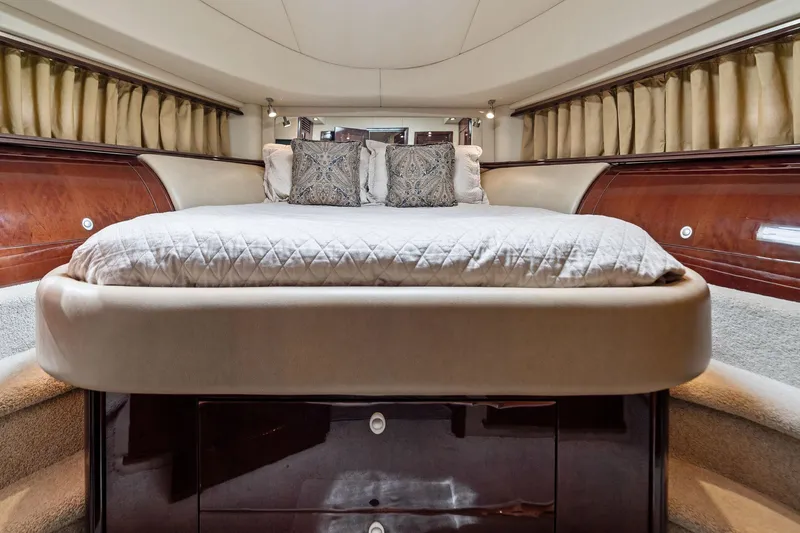 Sea-dels Yacht Photos Pics Luxurious bedroom interior of 2007 Sea Ray 58 Sedan Bridge yacht with elegant bedding.
