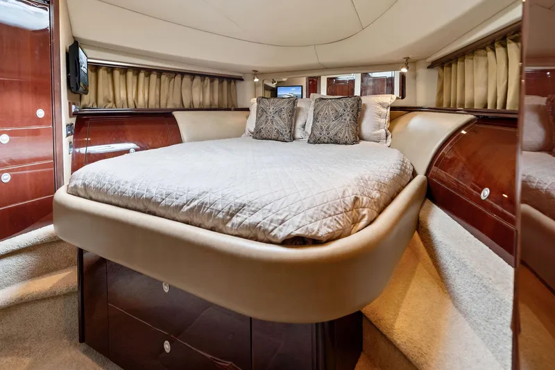 Sea-dels Yacht Photos Pics Luxurious bedroom interior of 2007 Sea Ray 58 Sedan Bridge yacht with elegant bedding.