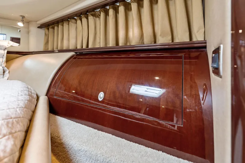Sea-dels Yacht Photos Pics Luxurious interior of 2007 Sea Ray 58 Sedan Bridge yacht with wood paneling.