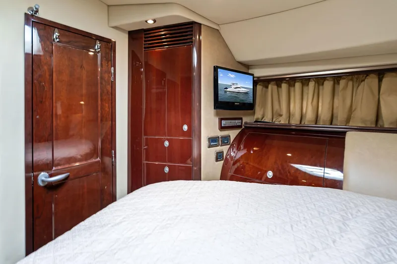 Sea-dels Yacht Photos Pics Luxurious 2007 Sea Ray 58 Sedan Bridge cabin with wood finishes and TV.