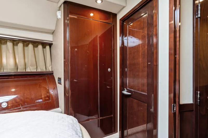 Sea-dels Yacht Photos Pics Luxurious interior of 2007 Sea Ray 58 Sedan Bridge yacht with polished wood finishes.
