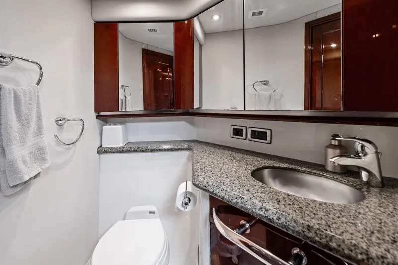 Sea-dels Yacht Photos Pics Luxurious bathroom in 2007 Sea Ray 58 Sedan Bridge yacht with granite countertop.