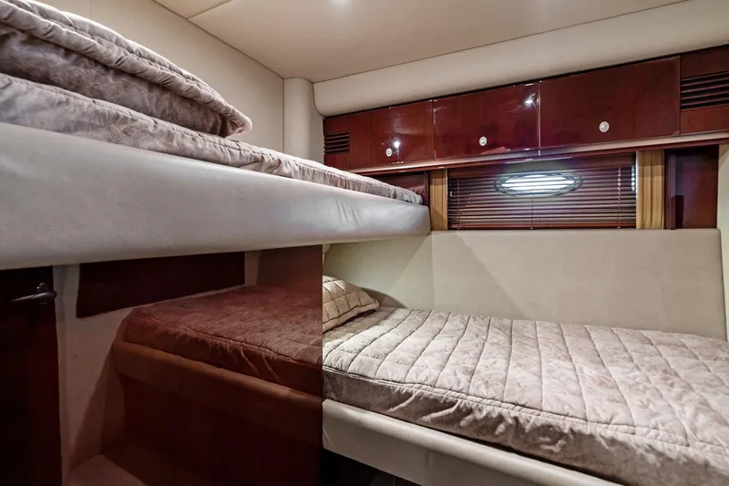 Sea-dels Yacht Photos Pics Luxurious cabin interior of 2007 Sea Ray 58 Sedan Bridge yacht with bunk beds.