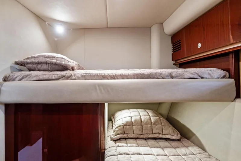 Sea-dels Yacht Photos Pics 2007 Sea Ray 58 Sedan Bridge cabin with cozy bunk beds and soft lighting.