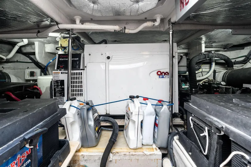 Sea-dels Yacht Photos Pics Engine room of 2007 Sea Ray 58 Sedan Bridge with Onan marine genset and maintenance supplies.