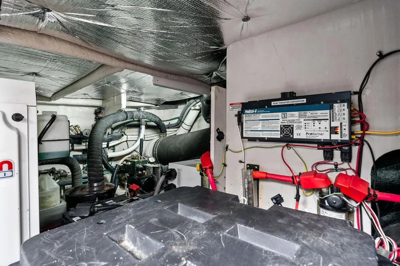 Sea-dels Yacht Photos Pics Engine room of 2007 Sea Ray 58 Sedan Bridge with mechanical components and wiring.