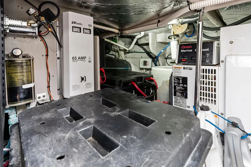 Sea-dels Yacht Photos Pics Engine room of 2007 Sea Ray 58 Sedan Bridge with battery charger and generator.