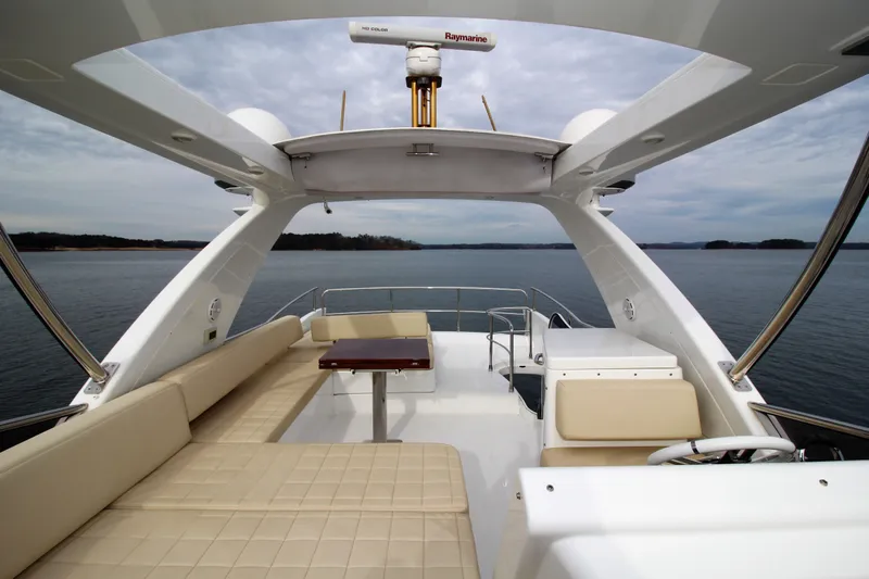 Raven Yacht Photos Pics Luxurious 2014 Azimut 54 Fly Bridge yacht with spacious seating and scenic water view.