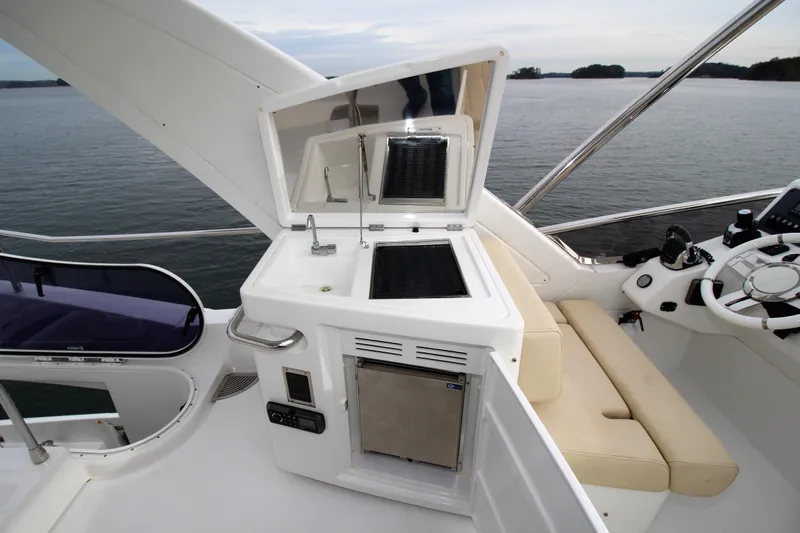 Raven Yacht Photos Pics Flybridge of 2014 Azimut 54 yacht with outdoor kitchen and seating area.