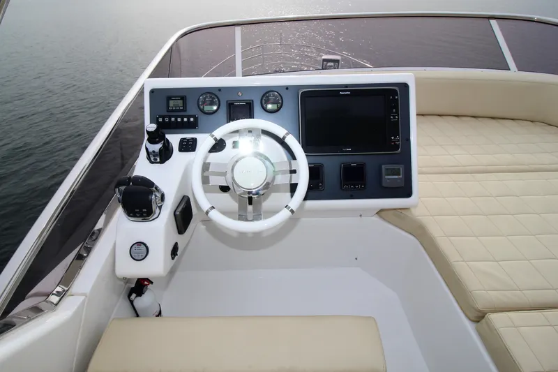 Raven Yacht Photos Pics 2014 Azimut 54 Fly Bridge yacht helm with modern controls and navigation system.