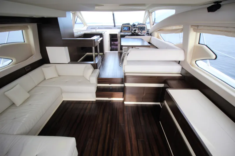 Raven Yacht Photos Pics Luxurious interior of 2014 Azimut 54 Fly Bridge yacht with elegant seating and modern design.