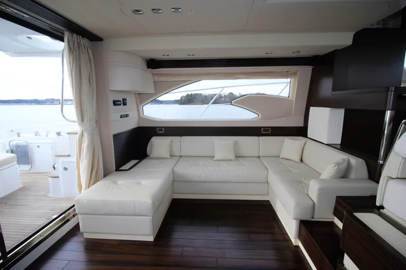 Raven Yacht Photos Pics Luxurious interior of 2014 Azimut 54 Fly Bridge yacht with elegant white seating.