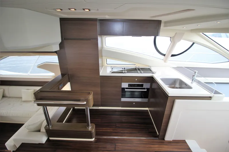Raven Yacht Photos Pics Luxurious interior of 2014 Azimut 54 Fly Bridge yacht with modern kitchen design.