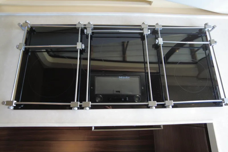 Raven Yacht Photos Pics Miele induction cooktop on 2014 Azimut 54 Fly Bridge yacht kitchen.