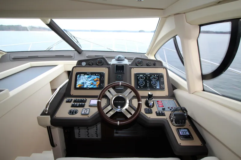 Raven Yacht Photos Pics 2014 Azimut 54 Fly Bridge yacht helm with advanced navigation controls and panoramic view.