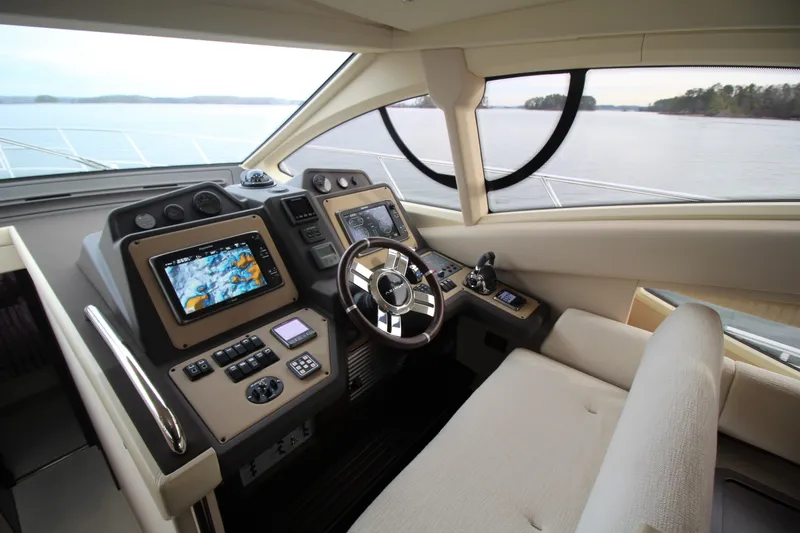 Raven Yacht Photos Pics 2014 Azimut 54 Fly Bridge yacht helm with advanced navigation systems and luxurious seating.