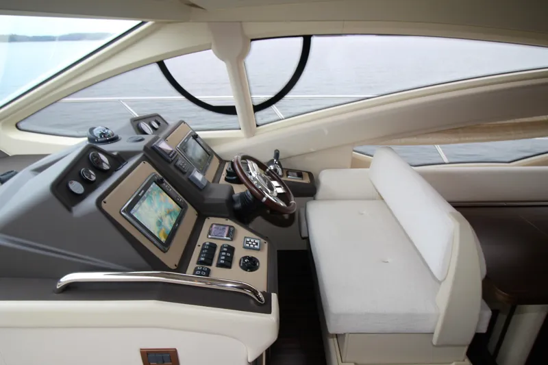 Raven Yacht Photos Pics 2014 Azimut 54 Fly Bridge yacht interior with modern navigation controls and seating.