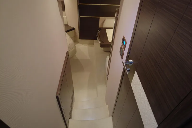 Raven Yacht Photos Pics Interior of 2014 Azimut 54 Fly Bridge yacht, featuring modern wood finishes and cozy design.