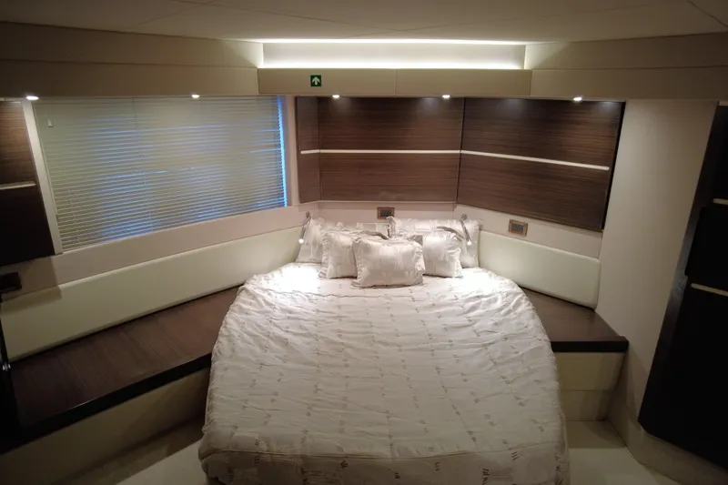 Raven Yacht Photos Pics Luxurious bedroom interior of 2014 Azimut 54 Fly Bridge yacht with elegant bedding.