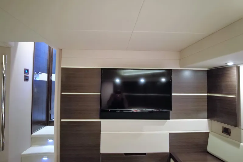Raven Yacht Photos Pics Interior of 2014 Azimut 54 Fly Bridge yacht with modern TV and sleek design.